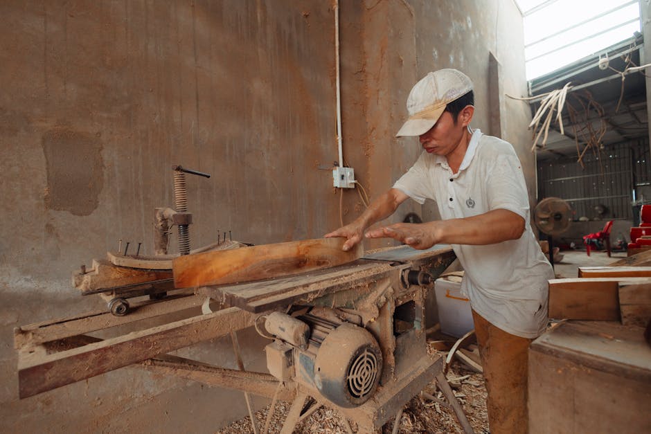Woodworker meticulously crafting handmade furniture in the workshop